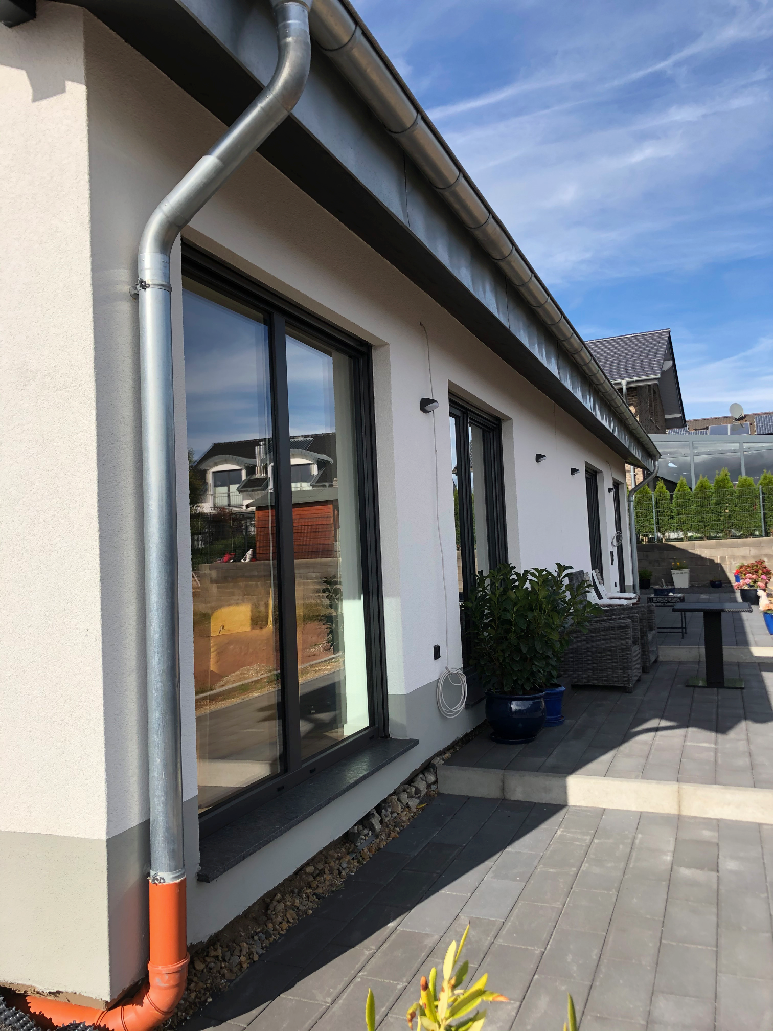 Two each of gray, white, and black shirts laying flat.